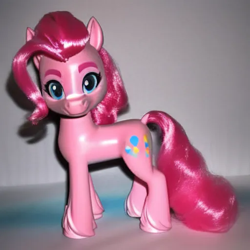 The image shows a pink pony toy with long pink hair and blue eyes. The pony is standing on all fours and has a happy expression on its face. It has a cutie mark of three balloons on its right hind leg. The toy is made of plastic and is about 6 inches tall.